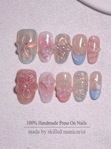 10 uñas postizas ovaladas cortas reutilizables con diseño de flor 3D y patrón de cinta en múltiples colores de caramelo, hechas a mano, con decoraciones de lazos para diseños de arte de uñas para mujeres y niñas en todas las estaciones