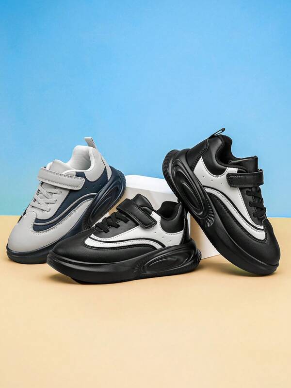 1 para czarno-białych butów szkolnych dla dzieci, całoroczne buty do chodzenia dla chłopców i dziewcząt z wodoodporną i antypoślizgową podeszwą, odpowiednie do codziennego noszenia i uprawiania sportu