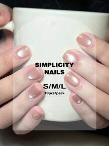 手工美甲配件套装，包括 10 件短椭圆形按压式指甲，可爱的粉色水晶猫眼设计，适合女孩、圣诞派对或日常佩戴，含 1 件指甲箔贴纸和 1 件指甲条用品 - 淺粉色 - 查看 7