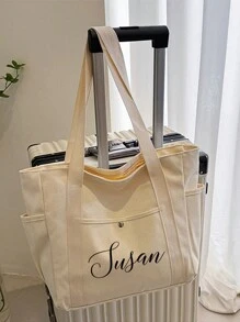 一款印有您名字的定制帆布手提袋。这款个性化手提袋可作单肩包、休闲购物袋使用，容量大，适合工作、旅行等多种场合，功能多样，用途广泛，轻便实用，是理想的学习用品。适合青少年、初中生、高中生、大学生、大一、大二及以下年级的学生使用。这款定制女士单肩包设计简洁舒适，时尚百搭。 - 米色 - 查看 3