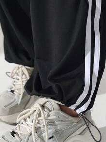 Pantalones deportivos casuales de tiro alto con bolsillos y raya lateral, de corte holgado. Pantalones de yoga con cordón, cintura elástica y puños, apropiados para el uso diario, trotar, hacer ejercicio