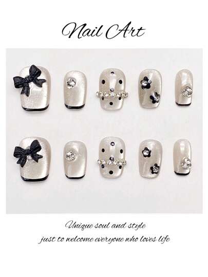 10片超短梯形美甲贴纸，可爱手绘花卉波点图案，黑色包边，蝴蝶结装饰，水钻点缀，适合派对、婚礼、日常佩戴，可重复使用，附赠1个指甲锉和1瓶指甲胶水，手工制作的按压式美甲贴片。