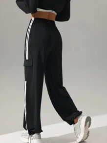 Pantalones deportivos casuales de tiro alto con bolsillos y raya lateral, de corte holgado. Pantalones de yoga con cordón, cintura elástica y puños, apropiados para el uso diario, trotar, hacer ejercicio
