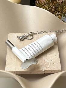 1 pièce Outil métallique à presser la crème colorante pour salon de coiffure, presse en forme de U avec forme de clé, idéal pour presser le dentifrice, le pigment, la crème capillaire