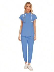 Conjunto uniforme hospitalario y dental de moda al por mayor con bata quirúrgica de unicolor, bolsillo, cuello en V, conjunto de uniformes de pantalones tipo jogger para mujeres