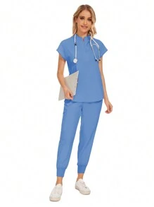 Conjunto uniforme hospitalario y dental de moda al por mayor con bata quirúrgica de unicolor, bolsillo, cuello en V, conjunto de uniformes de pantalones tipo jogger para mujeres