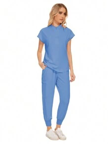Conjunto uniforme hospitalario y dental de moda al por mayor con bata quirúrgica de unicolor, bolsillo, cuello en V, conjunto de uniformes de pantalones tipo jogger para mujeres