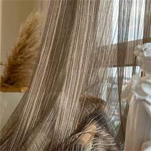 1 tấm rèm mỏng màu cà phê hiện đại với điểm nhấn là sợi chỉ vàng lấp lánh. Kết hợp chức năng che nắng với sự thanh lịch lọc ánh sáng. Được thiết kế với các lỗ khoen đục sẵn để dễ dàng lắp đặt, tấm rèm này lý tưởng để nâng cao phong cách của phòng ngủ, phòng khách và ban công đồng thời mang đến nét quyến rũ tinh tế, đương đại cho bất kỳ không gian nào. - Cà phê nâu - Xem 10