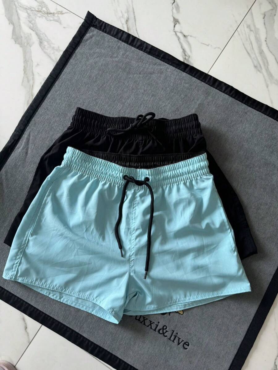 Kit With 2 Tactel Neon Women's Shorts, Ideal For All Occasions, Beach, Gym, Running, Casual. With Embroidered Symbol On The Leg, 2 Pockets Has Elastic At The Waist And Drawstring For Adjustment, And Can Be Worn Outside Or Inside The Shorts. - Màu xanh nhạt - Xem 1