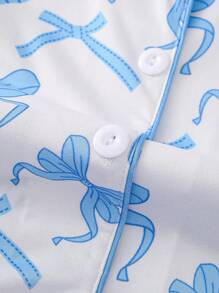 2 pièces Ensemble de vêtements de nuit pour femmes avec imprimé nœud, Top à manches longues avec col châle et pantalon ample à taille élastique avec poches. Pyjamas et vêtements de détente décontractés pour toutes les saisons