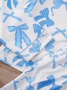 2 pièces Ensemble de vêtements de nuit pour femmes avec imprimé nœud, Top à manches longues avec col châle et pantalon ample à taille élastique avec poches. Pyjamas et vêtements de détente décontractés pour toutes les saisons