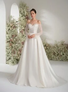 Palavras-chave Vestido de noiva com decote ombro a ombro, manga comprida, corte A, lantejoulas e renda, elegante, etéreo, romântico, luxuoso, para áreas externas, íntimo, vestido de noiva para jardim, vestido de noiva para igreja, noiva