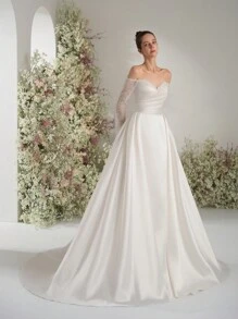 Palavras-chave Vestido de noiva com decote ombro a ombro, manga comprida, corte A, lantejoulas e renda, elegante, etéreo, romântico, luxuoso, para áreas externas, íntimo, vestido de noiva para jardim, vestido de noiva para igreja, noiva