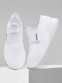 أحذية رياضية بنمط بسيط للرجال للجري على الطرق مع ربطة منزلقة ، أحذية مشي خفيفة الوزن مريحة ومنفذة للهواء ، أحذية رياضية للأوقات الحرة باللون الأبيض