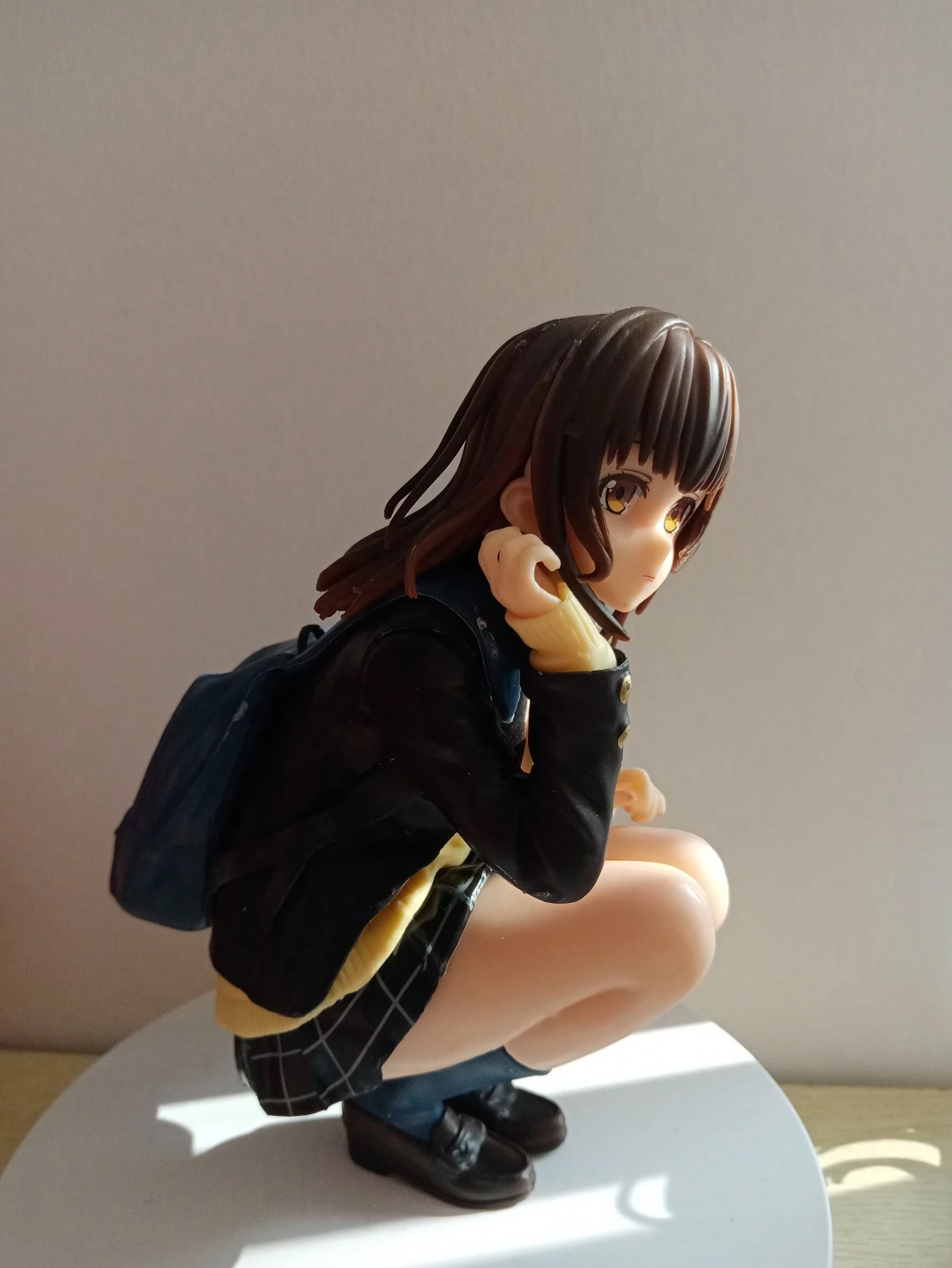 16 cm tall resin anime schoolgirl figure in a crouching pose, wearing a blue backpack and school uniform