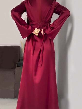 Vestido elegante de estilo árabe para mujer con cuello redondo, manga acampanada y detalle de lazo