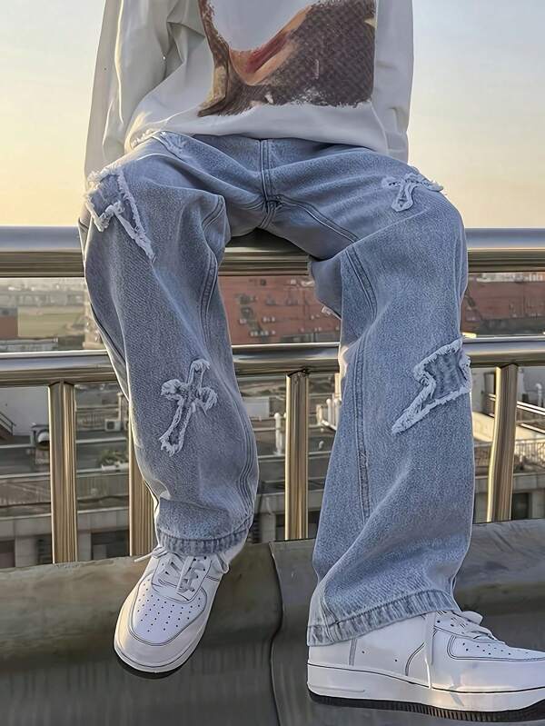 Jeans en denim bleu clair pour adolescent garçon avec patch de foudre brodé déchiré