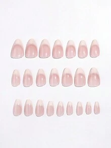 24 pièces d'ongles artificiels en forme d'amande avec une manucure française dégradée nude et blanc laiteux. Comprend 1 lime à ongles et 1 gel de gelée