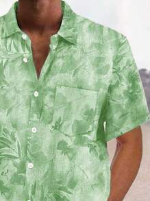 Camisa de manga corta con botones y estampado de flores y hojas hawaianas para hombre de talla grande