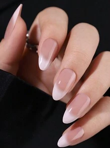 24 pièces d'ongles artificiels en forme d'amande avec une manucure française dégradée nude et blanc laiteux. Comprend 1 lime à ongles et 1 gel de gelée