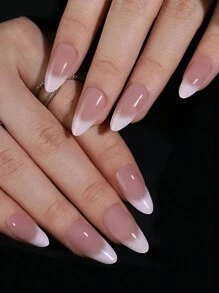 24 pièces d'ongles artificiels en forme d'amande avec une manucure française dégradée nude et blanc laiteux. Comprend 1 lime à ongles et 1 gel de gelée
