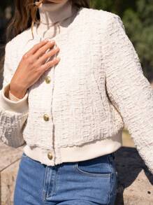 Veste courte en tweed à paillettes et col rond pour femme – Design sophistiqué et minimaliste, parfaite pour toutes les occasions : travail, événements formels ou rendez-vous romantiques.