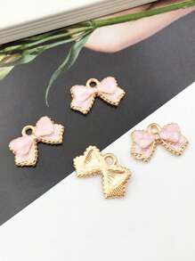 10 pièces Charmes de nœud en émail, pendentifs de nœuds papillon de couleurs assorties, mini nœuds papillon mignons pour artisanat DIY, bracelets, colliers, boucles d'oreilles, accessoires de bijouterie
