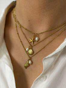 Monlansher Nuova collana alla moda in acciaio inossidabile con pendente a tema marino per donne, caratterizzata da vari elementi marini come conchiglie, cavallucci marini, stelle marine, tartarughe, decorata con perle d'acqua dolce, elegante e versatile per l'uso quotidiano