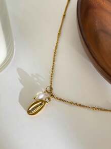 Monlansher Nuova collana alla moda in acciaio inossidabile con pendente a tema marino per donne, caratterizzata da vari elementi marini come conchiglie, cavallucci marini, stelle marine, tartarughe, decorata con perle d'acqua dolce, elegante e versatile per l'uso quotidiano