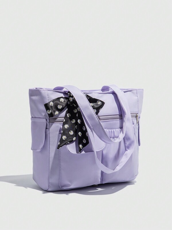 حقيبة كبيرة السعة وذات جيوب متعددة ذات لون واحد، بسيطة وخفيفة الوزن، تناسب الحاسوب المحمول