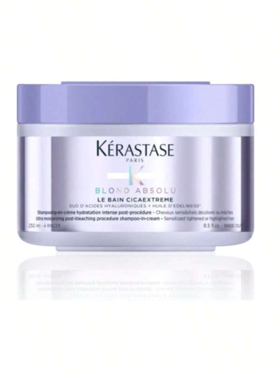 Kerastase Blond Absolu Le Bain Cicaextreme Is A Shampoo With The Consistency Of A Cream Designed For Extremely Bleached-Treated Blond Hair. This Type Of Hair Always Craves More Attention, And Le Bain Cicaextreme Provides The Ultimate Remedy And Ensures That Post-Bleached Locks Stay Clean, Strong, And Healthy. It Gently And Effectively Cleanses And Removes Impurities Without Stripping By Creating A Rich Texture That Easily Foams Between The Hair With Decreased Friction, Which Makes This Shampoo Perfect For Sensitized And Delicate, Lightened, Or Highlighted Hair. Kerastase Blond Absolu Le Bain Cicaextreme Is Enriched With A Fantastic Blend Of Hyaluronic Acid That Hydrates Hair Fiber And Edelweiss-In-Oil That Delivers Softness And Reconstruction. This Breakthrough Shampoo Intensely Replenishes And Restores Elasticity And Is Perfect For Fragile Blond Hair Needing A Reinforcing Cure. - White - View 1