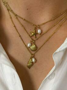 Monlansher Nuova collana alla moda in acciaio inossidabile con pendente a tema marino per donne, caratterizzata da vari elementi marini come conchiglie, cavallucci marini, stelle marine, tartarughe, decorata con perle d'acqua dolce, elegante e versatile per l'uso quotidiano