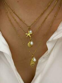 Monlansher Nuova collana alla moda in acciaio inossidabile con pendente a tema marino per donne, caratterizzata da vari elementi marini come conchiglie, cavallucci marini, stelle marine, tartarughe, decorata con perle d'acqua dolce, elegante e versatile per l'uso quotidiano