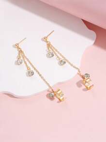 1 paire de boucles d'oreilles dorées style hip hop avec chaîne de strass à gland clip sur l'oreille