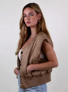 Gilet matelassé à boutons pour femmes. Avec poches latérales et taille élastique. Parfait pour une tenue scolaire, une veste de printemps, une tenue de bureau.
