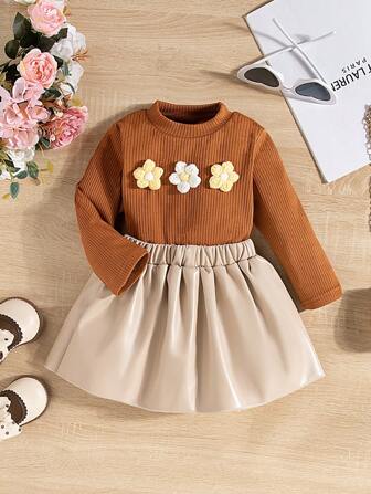 2 pezzi/set Top casual lavorato a maglia con decorazione floreale + gonna in PU, set da indossare tutti i giorni, adatto per primavera/autunno