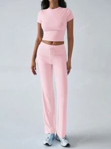 Conjunto de dos piezas de ropa deportiva casual diaria de unicolor de manga corta y cuello redondo, pantalones rectos delgados y largos para mujer en otoño Y2K