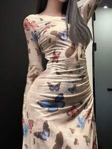 女士圆领长袖蝴蝶全身印花休闲长裙