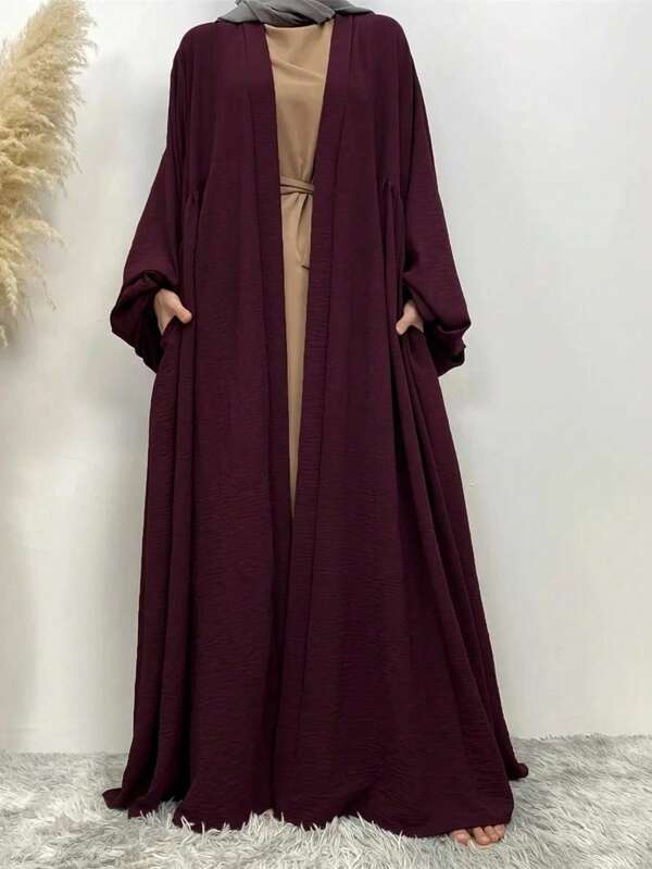 Abaya de manga larga de un solo color con bolsillo, estilo abaya casual para mujer