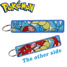 pocket monsters 1 pièce Porte-clés de personnage de dessin animé, pendentif brodé élégant, accessoire de mode et cadeau pour hommes et femmes. Accessoire de voiture, charm de sac à dos pour l'école