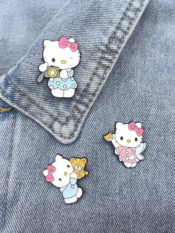 Sanrio Sanrio, broche de metal japonês criativo fofo com desenho de gato KT, acessório para roupas, crachá fofo de esmalte, adequado para bolsas, roupas, etc., acessórios para vestidos, broche para bolsa de roupas, pingente escolar