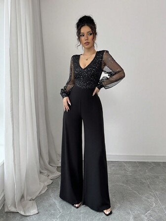 Mono elegante y casual para fiesta y reunión de Año Nuevo, con cuello en V, tela brillante negra, mangas de malla, patchwork, mono con aplicaciones de cristales y ciñe la cintura para mujeres