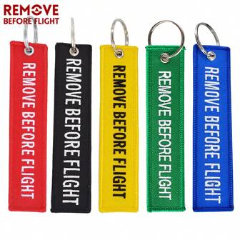 REMOVE BEFORE FLIGHT 1 pieza Llavero casual de poliéster (terileno) con bordado de letra "REMOVE BEFORE FLIGHT" para mochila escolar