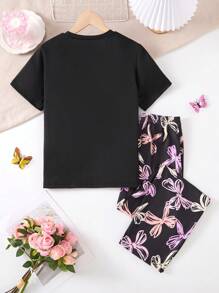 A 2 Pieces Set Of Fashionable Tween Girl Home Clothes, A Casual Purple Bow Printed Round Neck Black Short Sleeved Top Paired With A Black Full Printed Colorful Bow Pattern Straight Leg Pants Set, Suitable For Casual Wear At Home In Spring, Autumn, And Summer