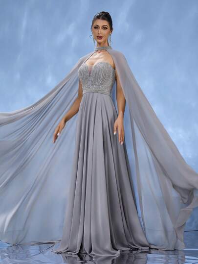 DELLA COUTURE Elegant And Slim-Fitting Grey Long Evening Gown For Women. It Features A Large-Swing Design, Paired With A Flowing Cape, And Is Delicately Adorned With Sequins. This Gown Is Perfect For Evening Parties, Gatherings, And Cocktail Parties, Making It A Truly Gorgeous Long Dress., Party Dress, Wedding Guest Dress, Formal Dress