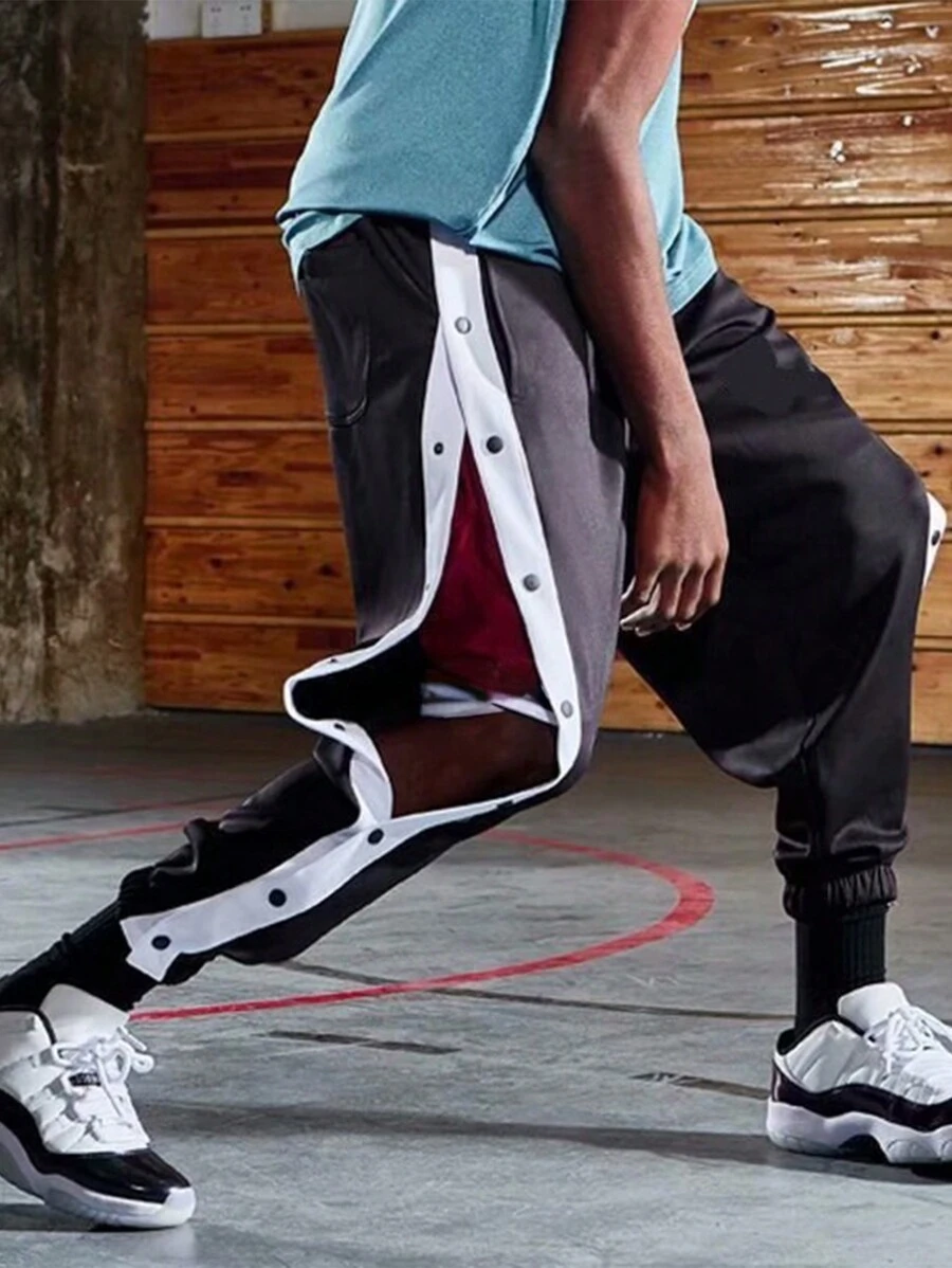 Pantaloncini da basket con bottoni laterali in stile americano, uomo, pantaloni sportivi per riscaldamento, vestibilità morbida e gamba affusolata, pantaloni da allenamento, streetwear - nero - Visualizzare 1