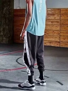 Pantaloncini da basket con bottoni laterali in stile americano, uomo, pantaloni sportivi per riscaldamento, vestibilità morbida e gamba affusolata, pantaloni da allenamento, streetwear - nero - Visualizzare 4