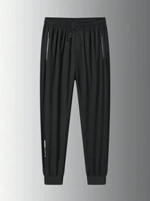 Pantalon de sport pour hommes en soie glacée mince, séchage rapide et respirant. Nouveaux pantalons à cordon de serrage pour l'entraînement fitness, la course et le basket d'été. Joggers slim de travail