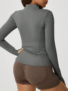 Chaqueta deportiva de manga larga con cremallera y ojal para el pulgar, de unicolor, para mujer