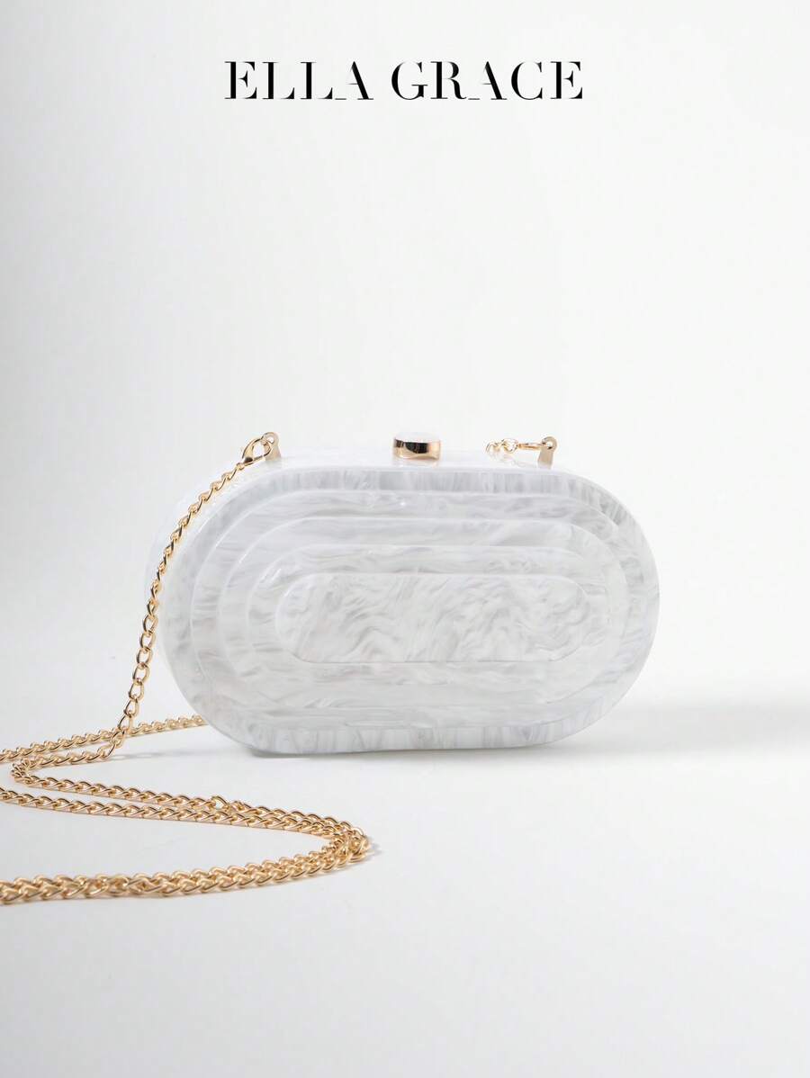 迷人的椭圆形亚克力晚宴包 - 层叠收缩的层次感犹如蛋糕，有米色和香槟色可选，饰有大理石纹路和金属链。非常适合情人节、年终派对、庆祝宴会的女性。适合特殊场合的贴心礼物。适合在宴会和派对上赠送的理想礼物。